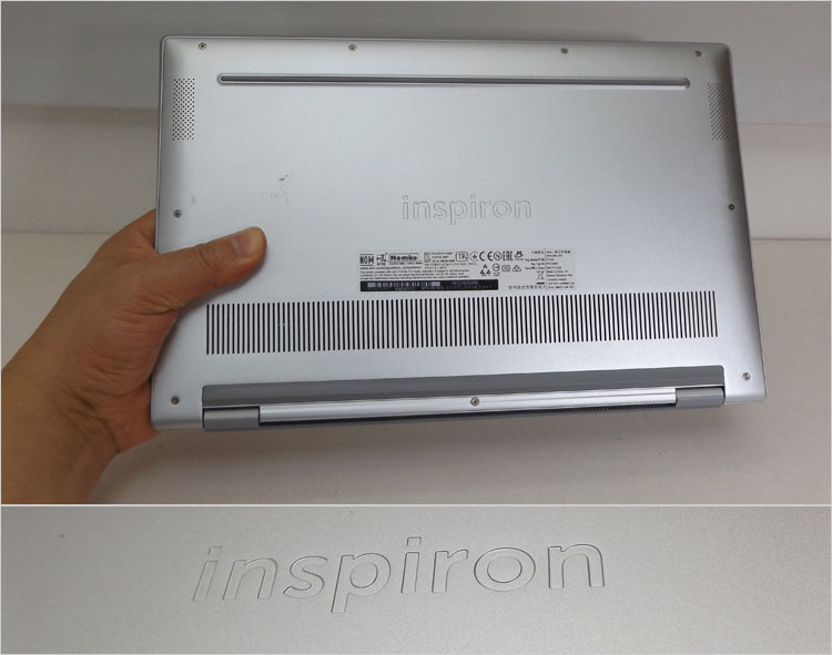中央にはプレス加工されたエンボスのInspironロゴ